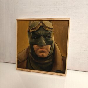 Angled view of small Batman Knightmare oil painting on wood panel by Oskari Myllymäki, showcasing textured brushwork.