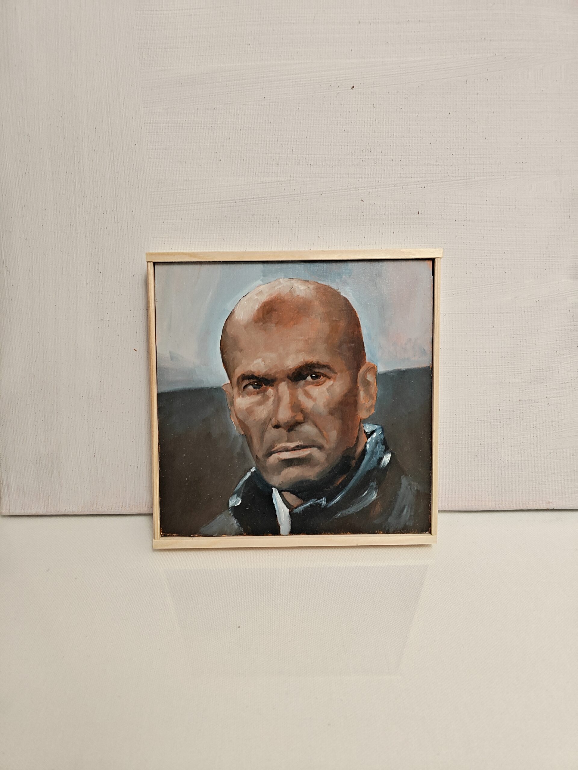 The Zinedine Zidane original oil painting displayed to show the scale of this football fine art piece