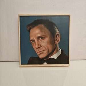Detail of traditional oil textures on a hand-painted James Bond portrait, 8x8 inch wood panel art.