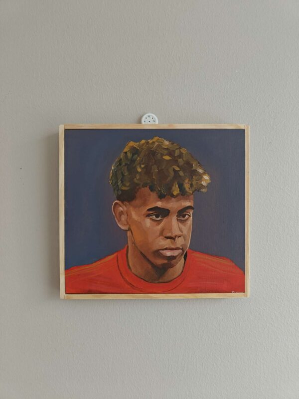 Angled side view of the Lamine Yamal football portrait showing the wood panel depth.