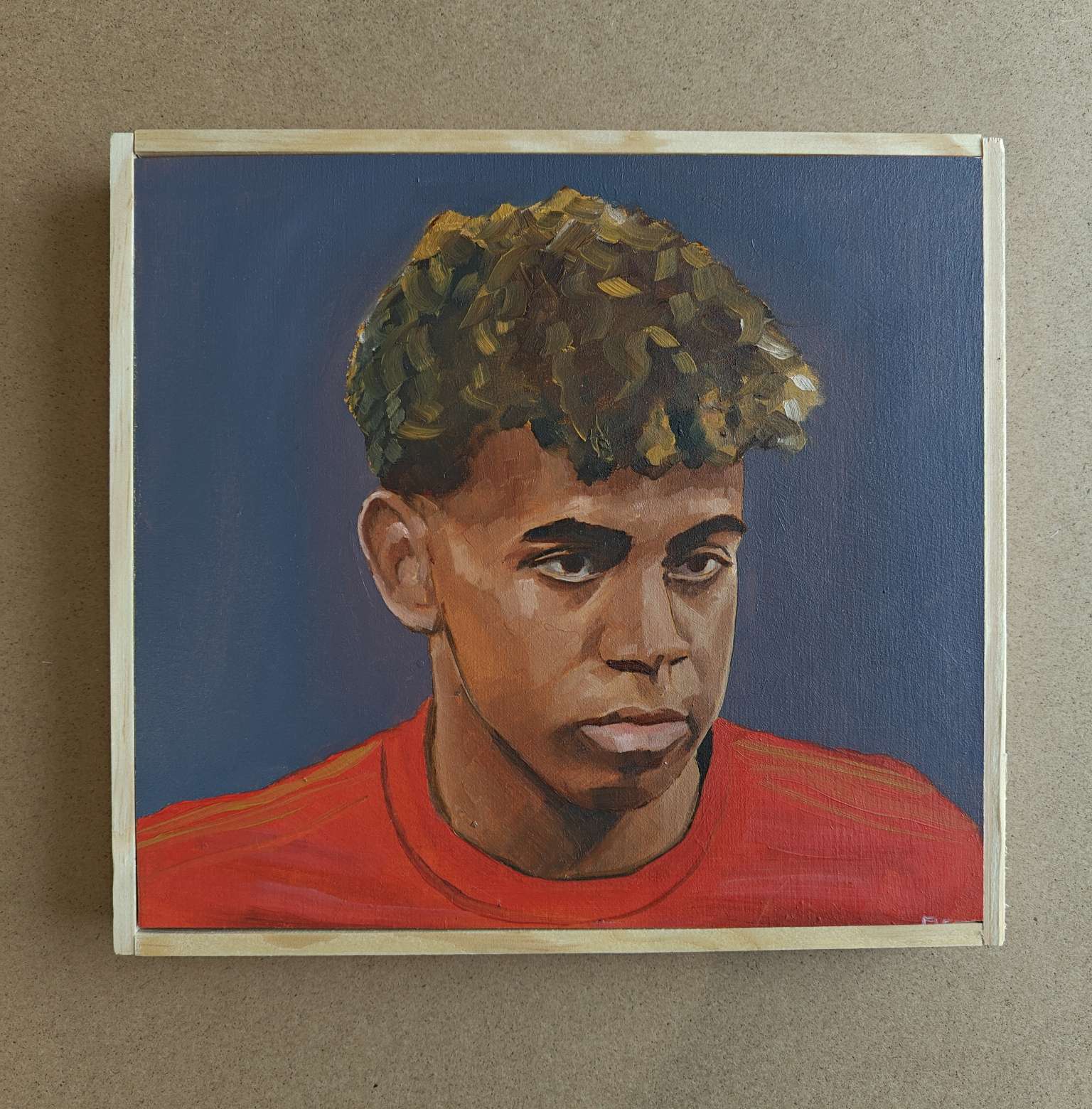 Front view of the 20x20cm Lamine Yamal original oil painting hanging on a studio wall