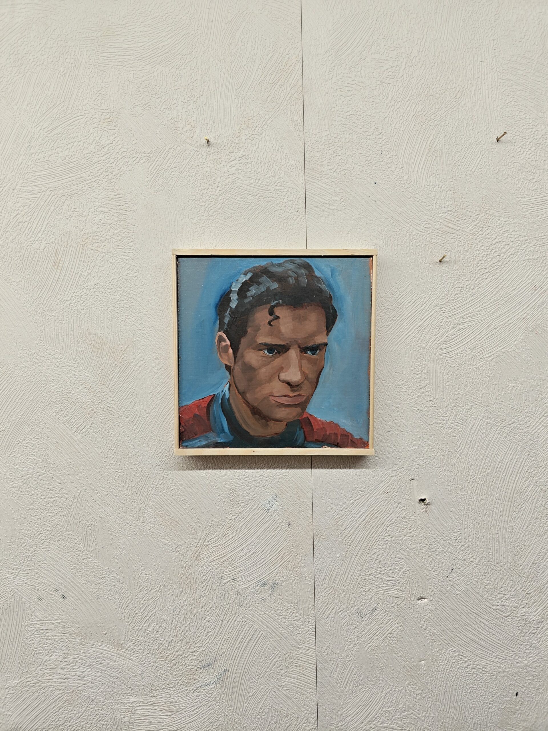 Side profile of Superman oil painting showing texture of professional oil pigments