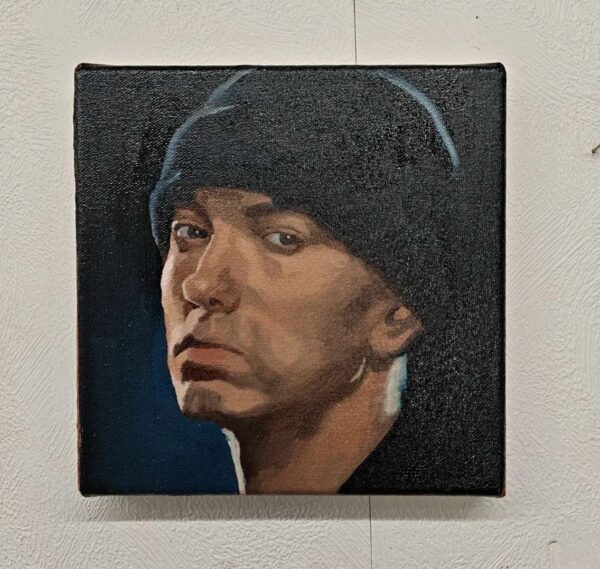 Front view of the 20x20cm Eminem original oil painting on stretched canvas capturing the rap legend in a dark beanie